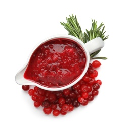 Photo of Pitcher of cranberry sauce with rosemary on white background, top view