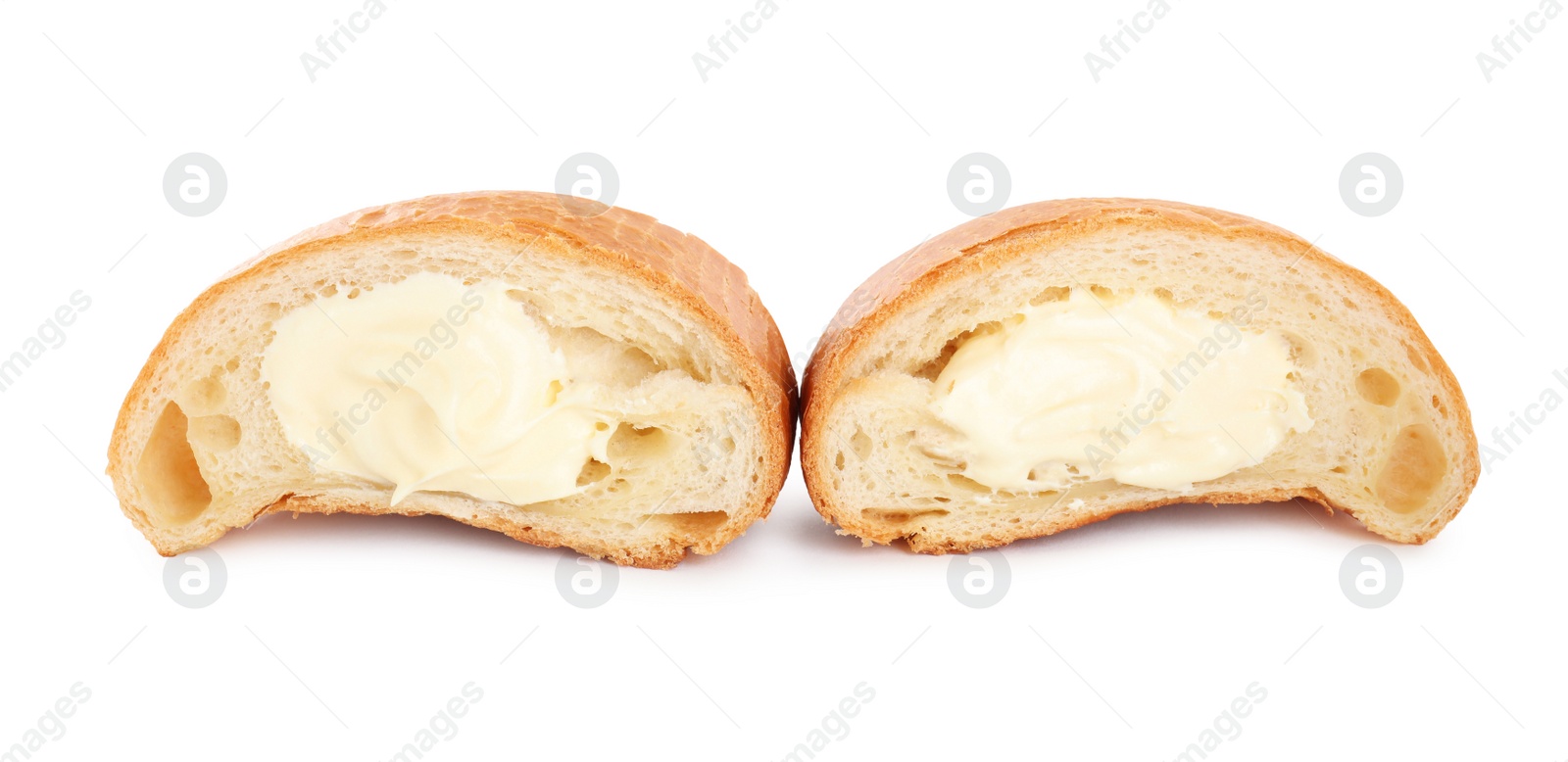 Photo of Halves of delicious croissant with cream on white background