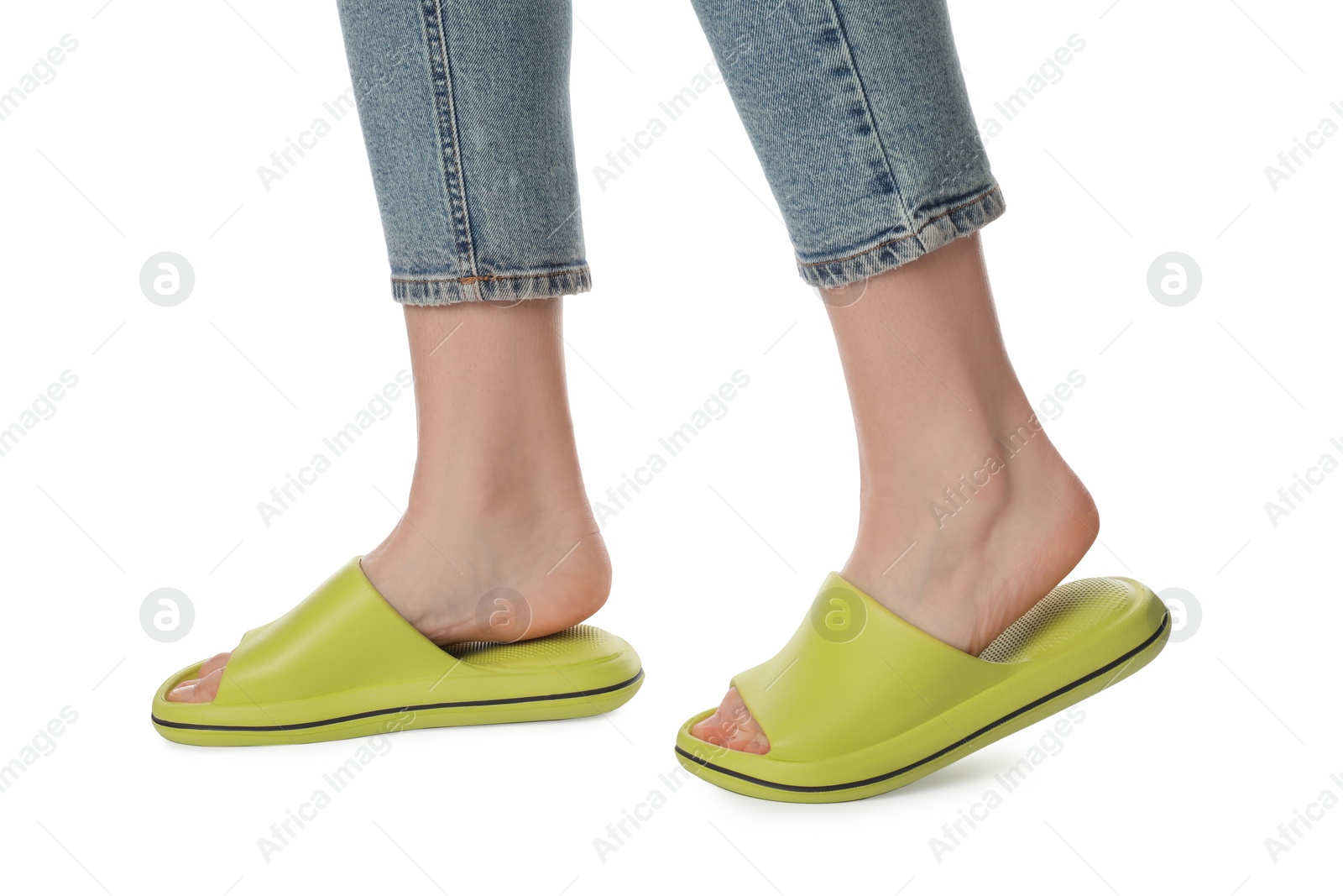 Photo of Woman in green slippers on white background, closeup