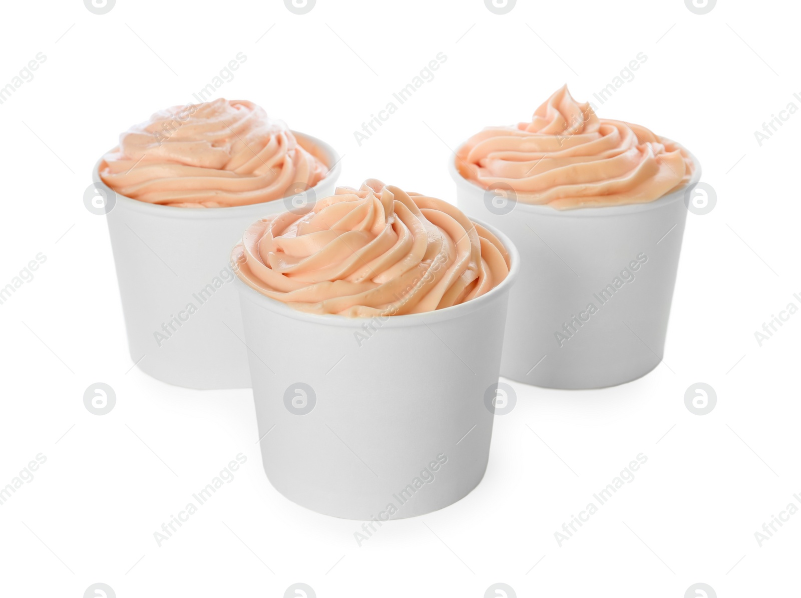 Photo of Cups with tasty frozen yogurt on white background