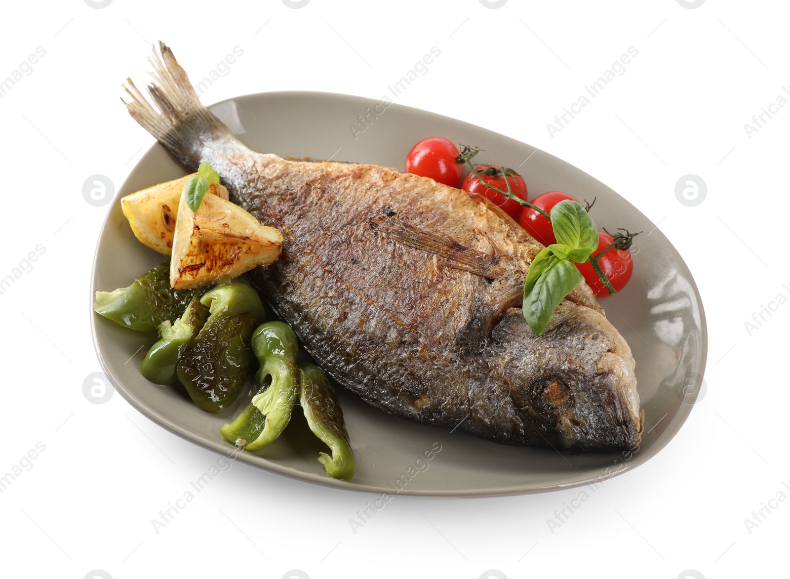 Photo of Delicious roasted dorado fish, vegetables, and lemon isolated on white, above view