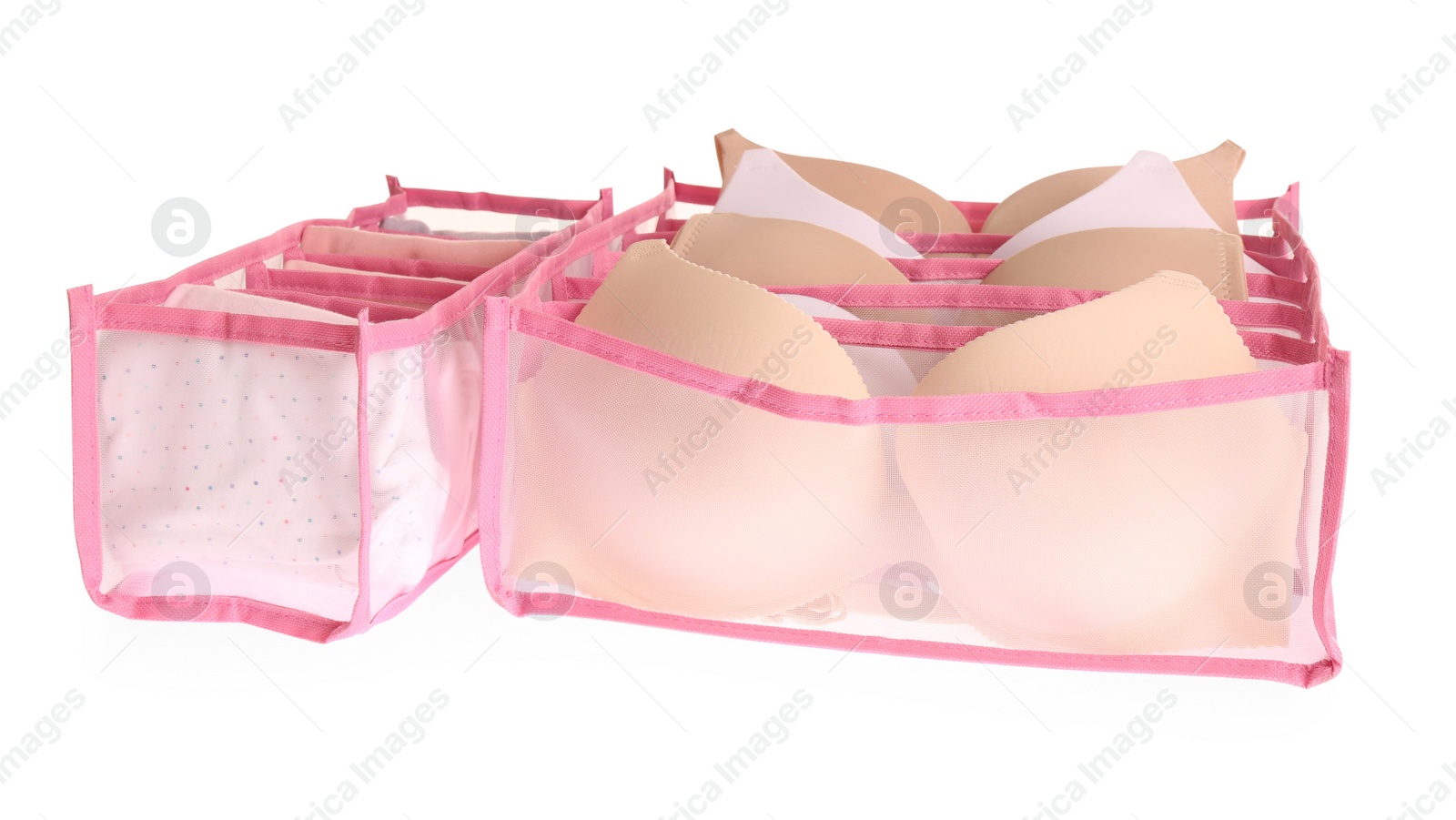 Photo of Transparent organizers with underwear on white background