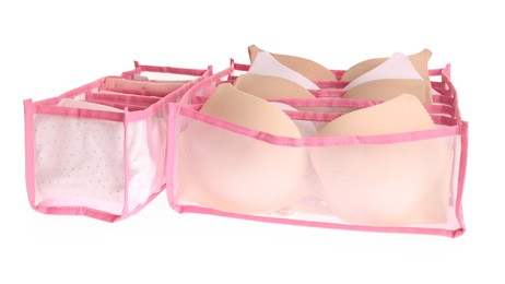 Transparent organizers with underwear on white background