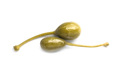 Two delicious pickled capers on white background, top view