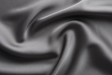 Photo of Texture of beautiful light grey silk fabric as background, closeup