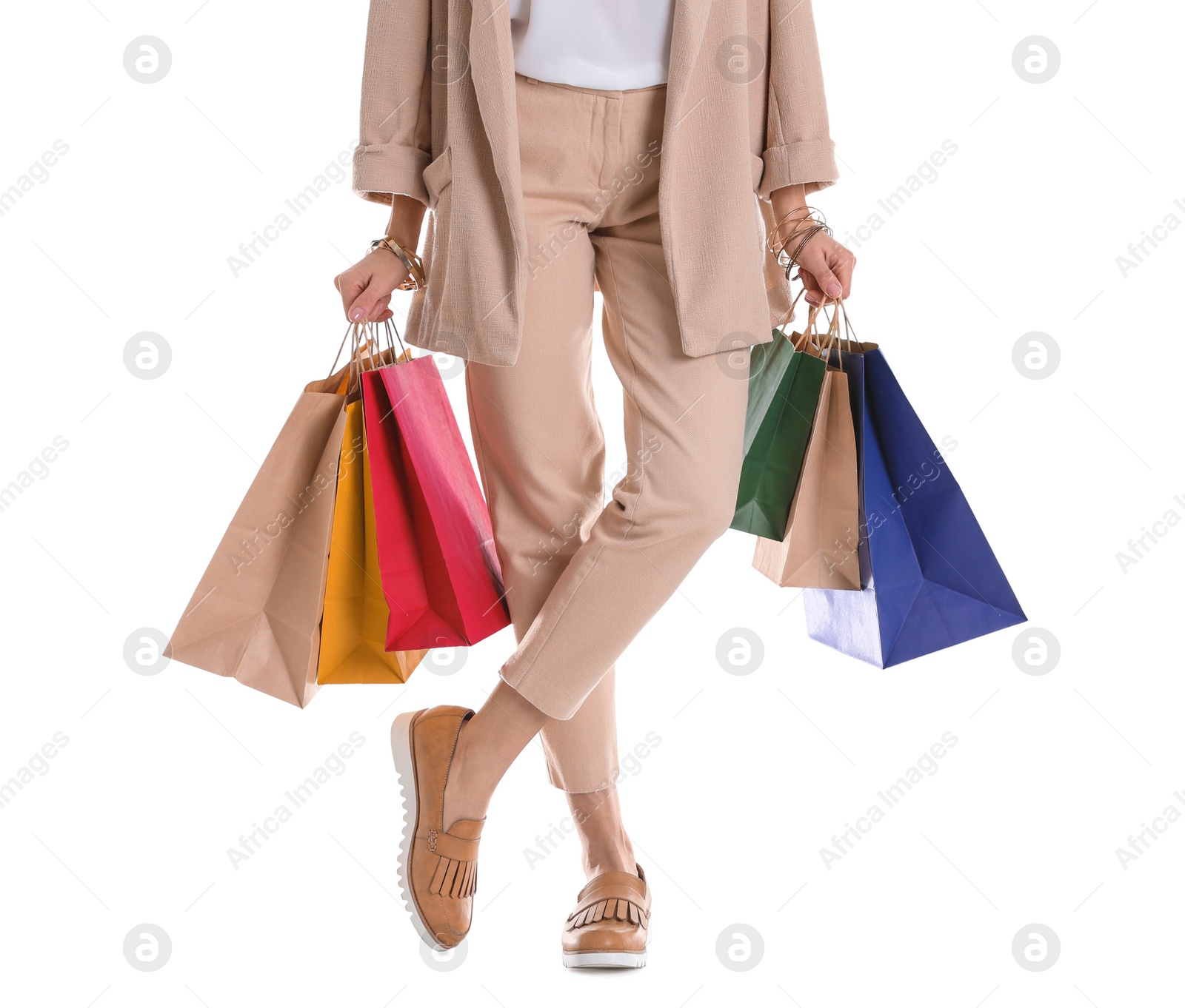 Photo of Young woman with shopping bags on white background, closeup