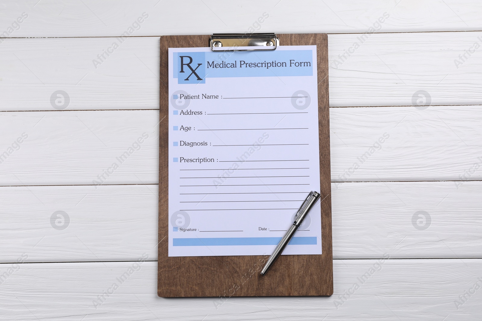 Photo of Medical prescription form with empty fields and pen on white wooden table, top view