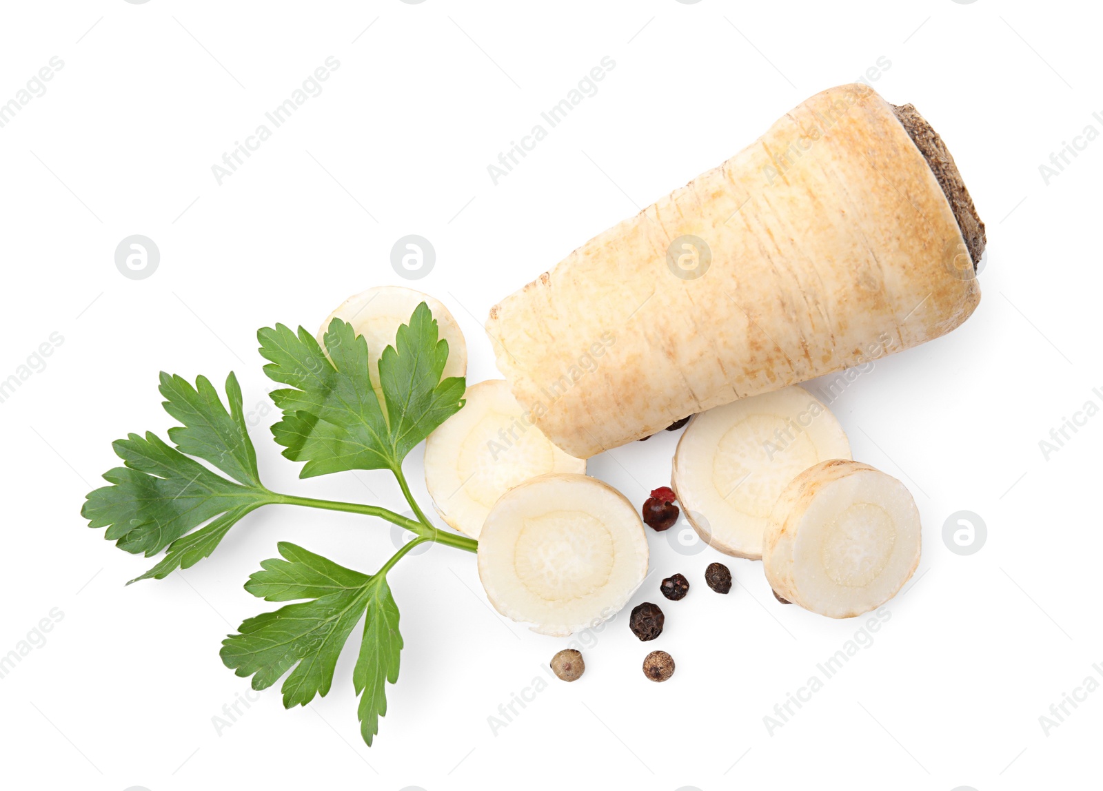 Photo of Whole and cut raw parsley root, fresh herb isolated on white, top view