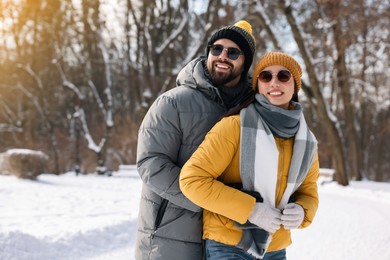 Beautiful happy couple spending time together on winter day