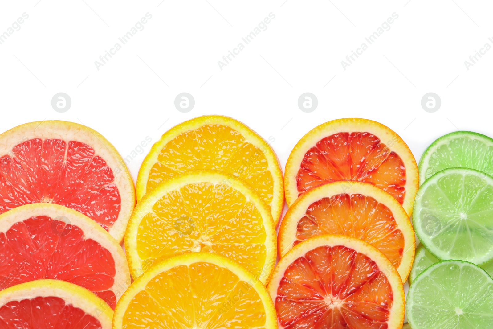 Photo of Slices of fresh citrus fruits on white background, top view