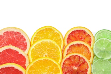 Photo of Slices of fresh citrus fruits on white background, top view