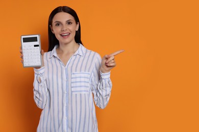 Photo of Happy accountant with calculator on orange background, space for text