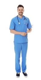 Photo of Full length portrait of smiling male doctor in scrubs with clipboard isolated on white. Medical staff