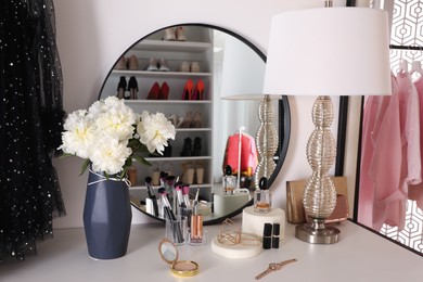 Photo of Stylish dressing table in modern wardrobe room