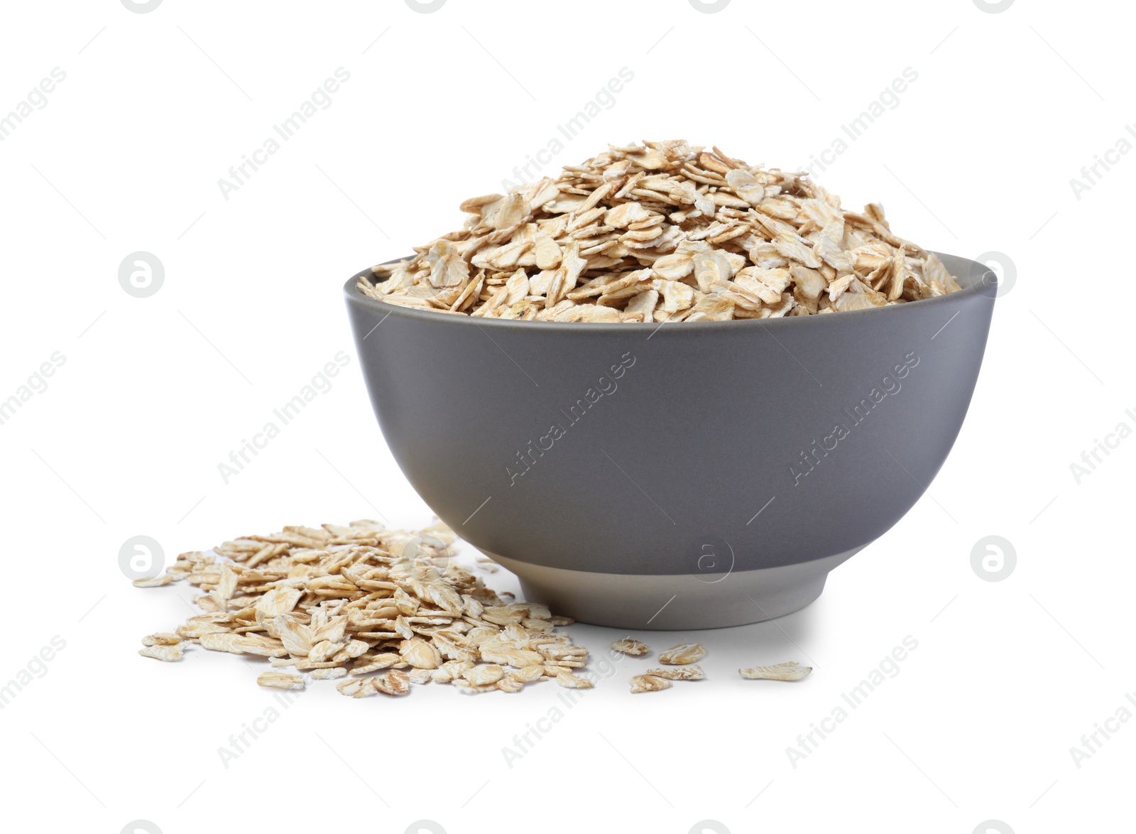 Photo of Raw oatmeal and grey bowl on white background