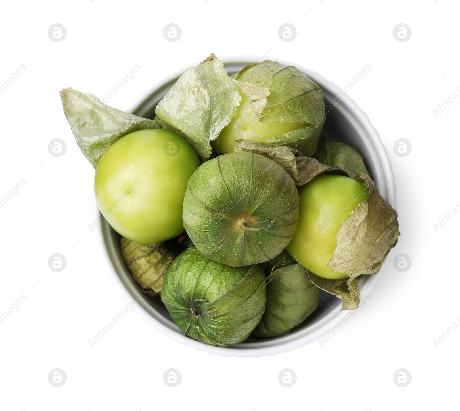 Photo of Bowl of fresh green tomatillos with husk isolated on white, top view