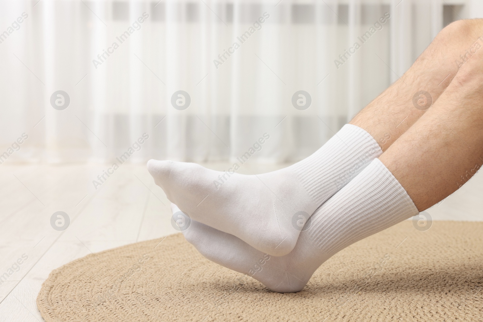 Photo of Man in stylish white socks indoors, closeup