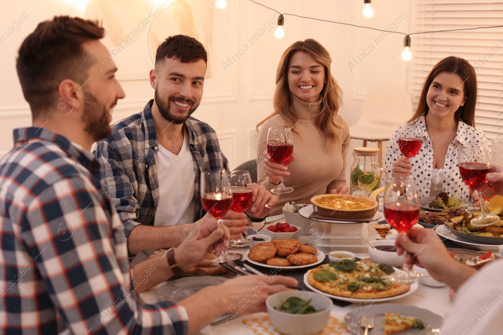 Photo of Group of people having brunch together at table indoors