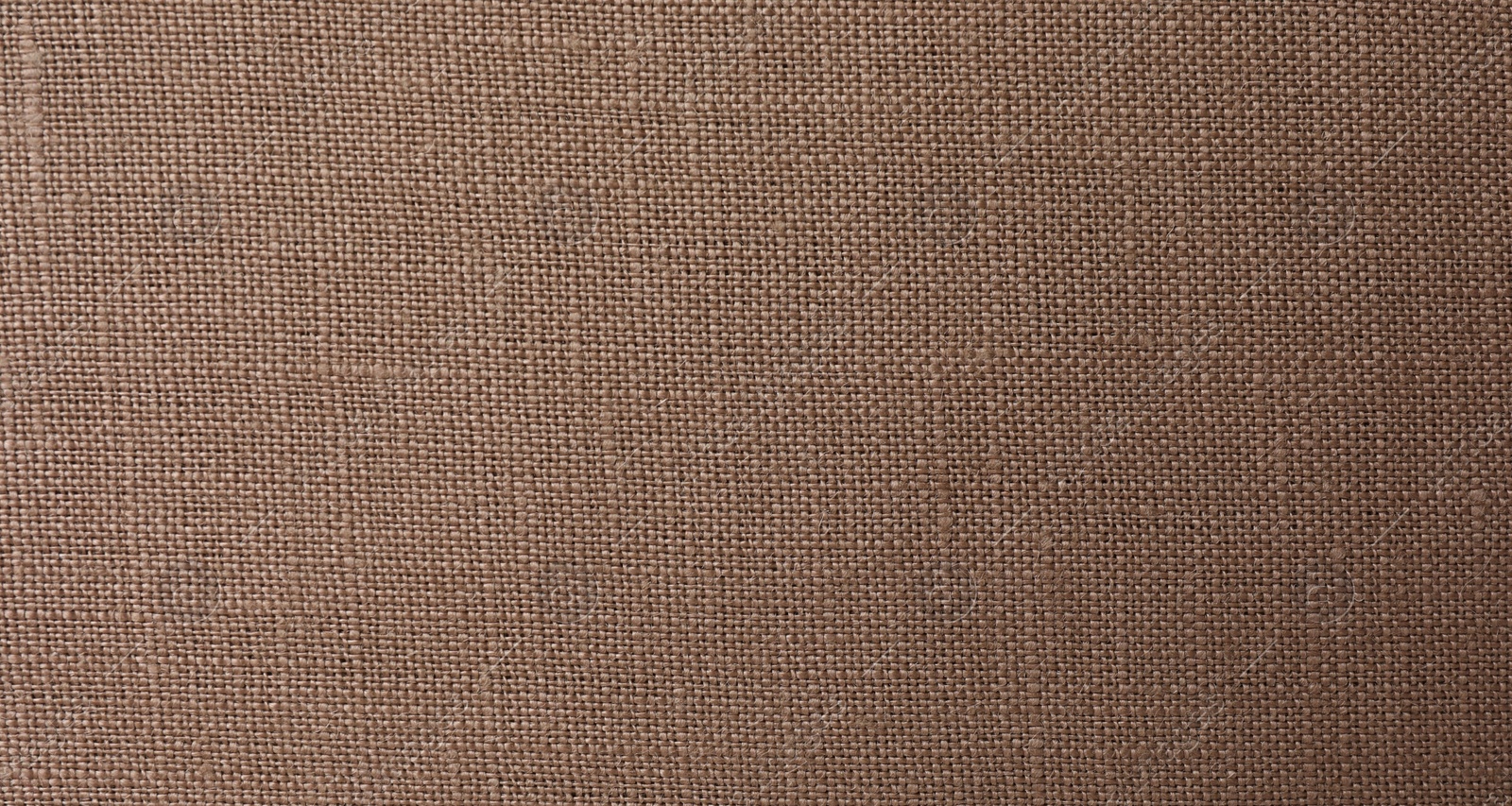 Photo of Texture of brown fabric as background, top view