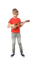 Photo of Cute little boy playing guitar isolated on white