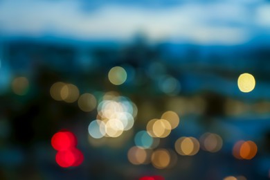 Photo of Blurred view of cityscape in evening. Bokeh effect