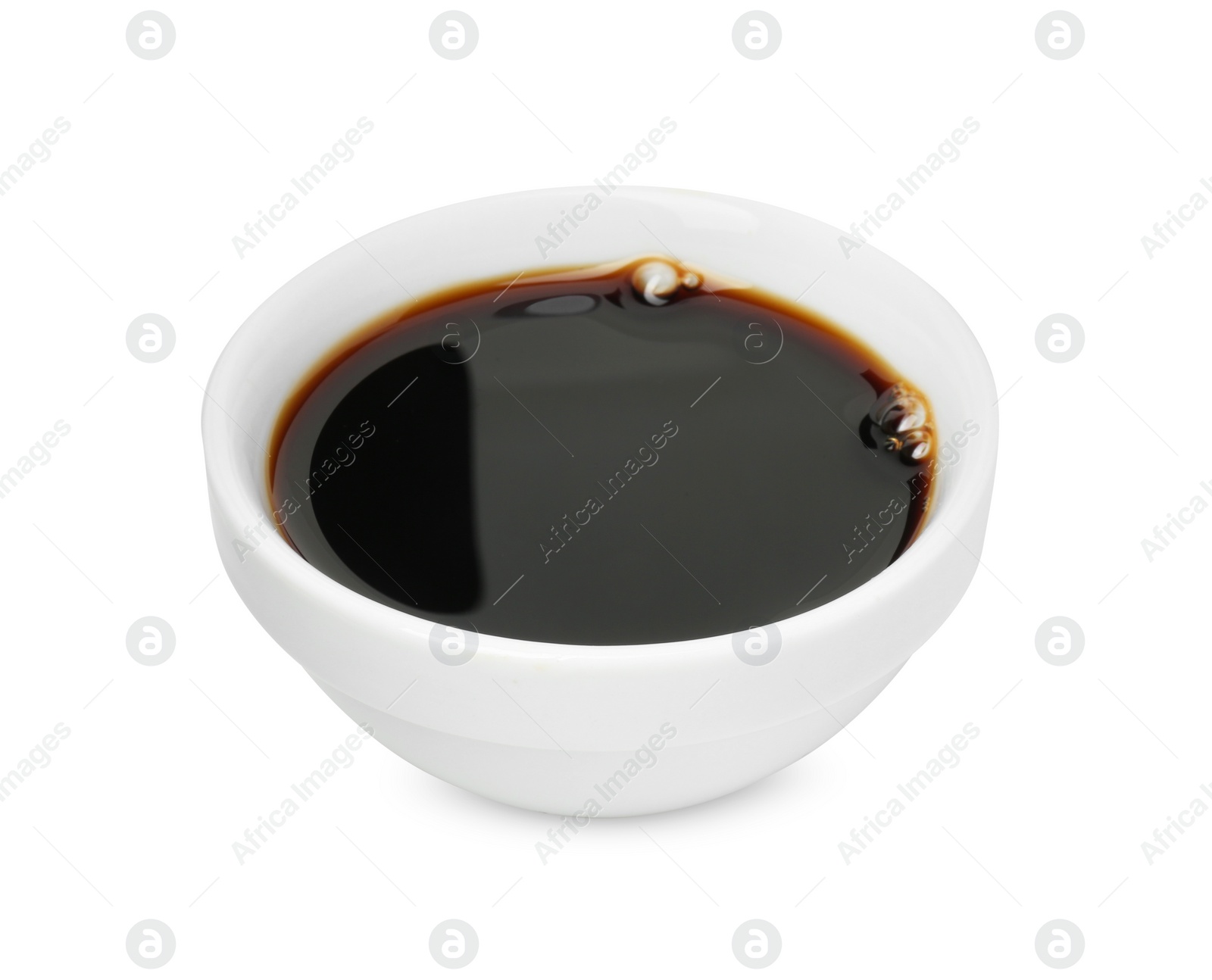 Photo of Tasty soy sauce in bowl isolated on white