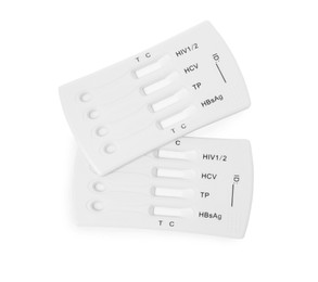 Photo of Two disposable express tests for hepatitis on white background, top view