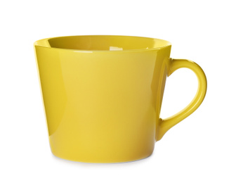 Photo of Beautiful yellow ceramic cup isolated on white