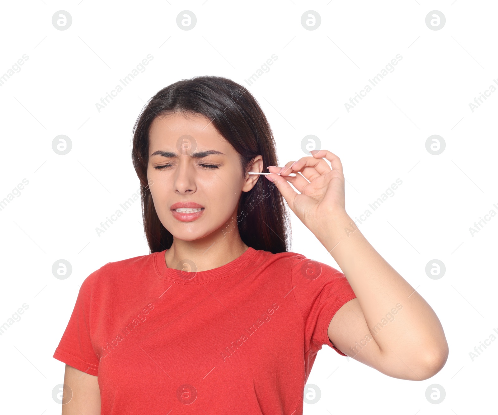 Photo of Young woman cleaning ear with cotton swab on white background