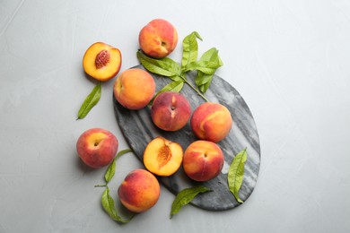 Photo of Fresh sweet peaches on light table, flat lay