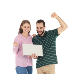 Emotional young people with laptop celebrating victory on white background