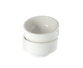 Photo of New ceramic bowls on white background. Tableware