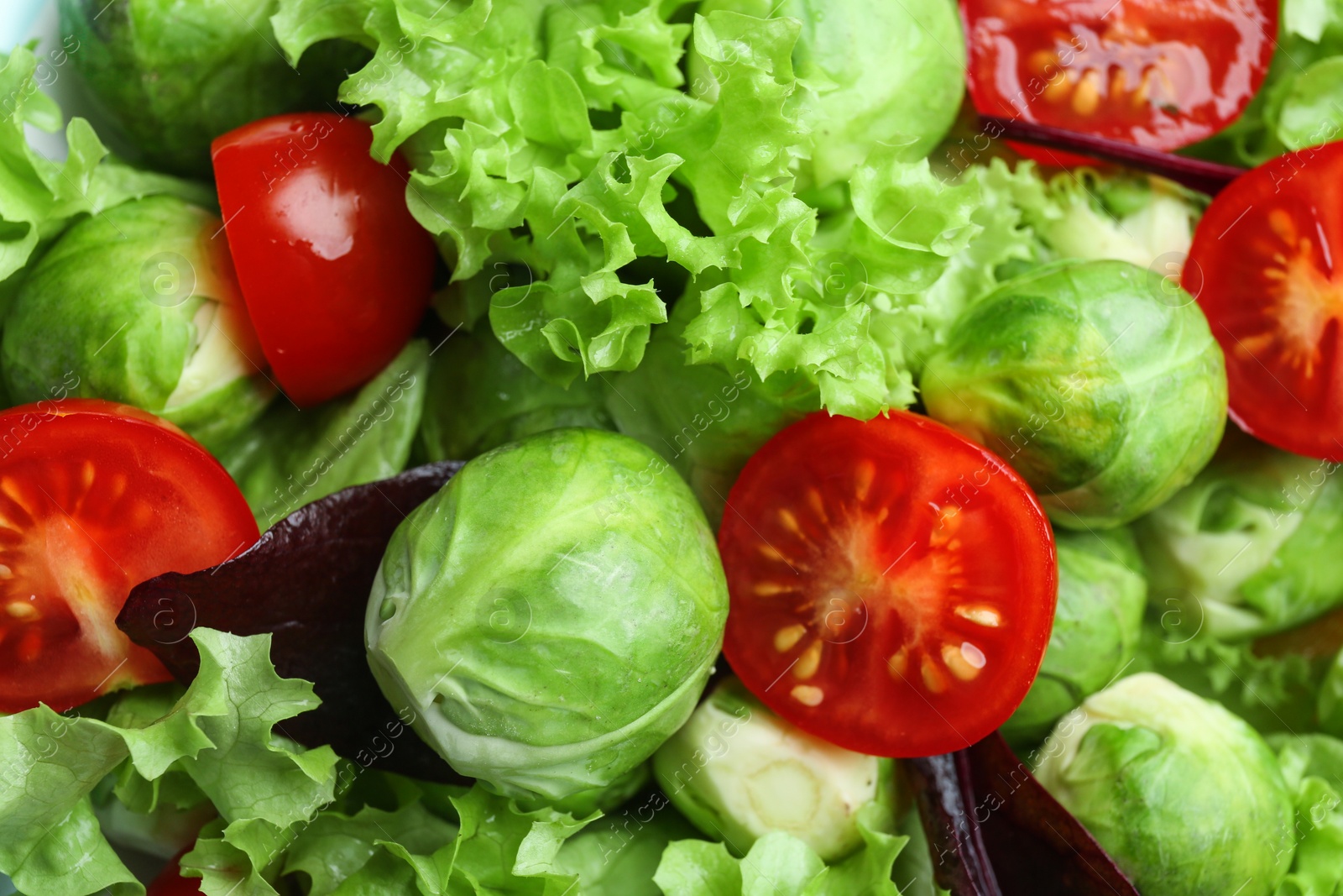 Photo of Tasty salad with Brussels sprouts as background, closeup