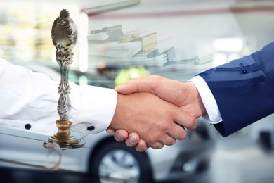 Multiple exposure of documents, vintage stamp and business partners shaking hands, closeup