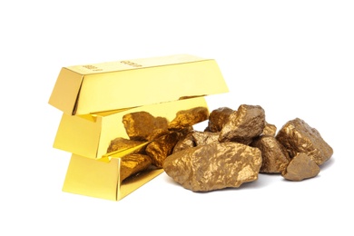 Photo of Gold nuggets and ingots on white background