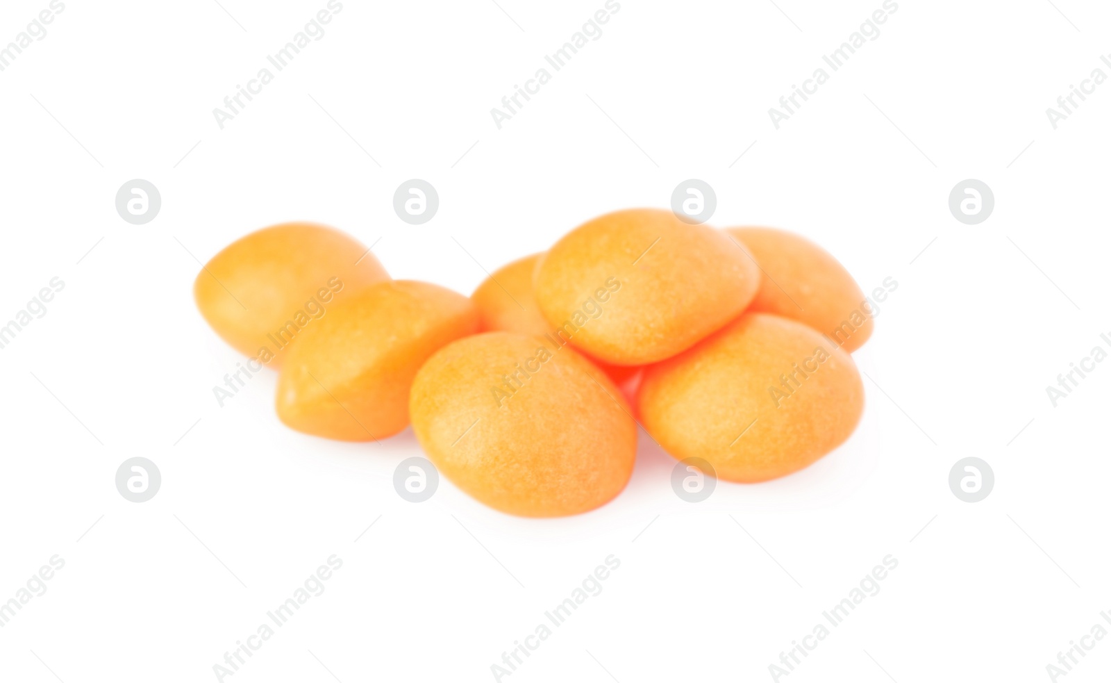 Photo of Tasty orange chewing gums isolated on white