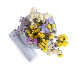 Photo of Marble mortar with different flowers and pestle on white background, top view