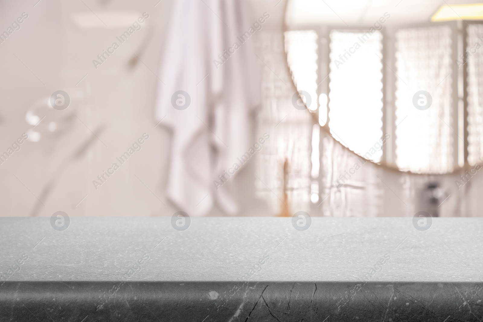 Image of Empty table and blurred view of stylish bathroom interior