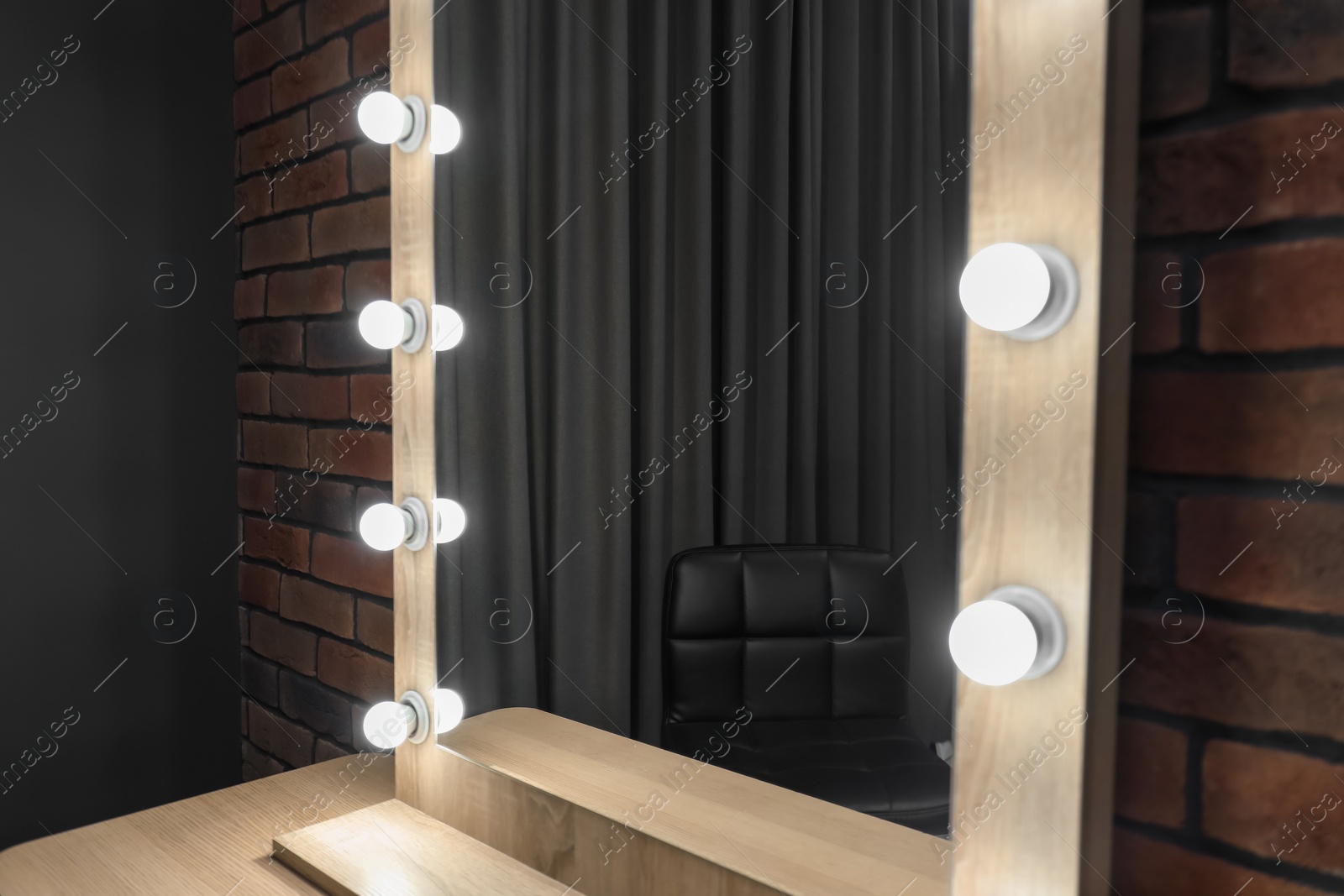 Photo of Mirror with light bulbs in makeup room