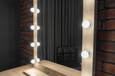 Photo of Mirror with light bulbs in makeup room