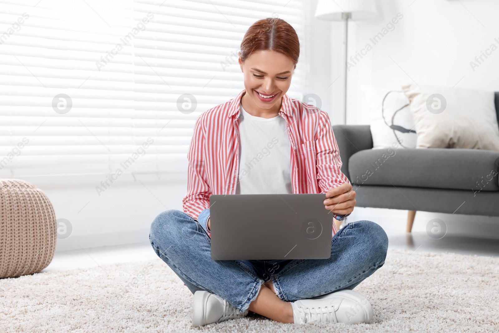 Photo of Woman having video chat via laptop at home