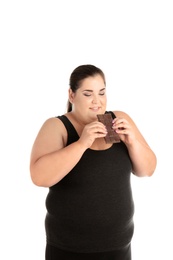 Photo of Overweight woman with chocolate bar on white background