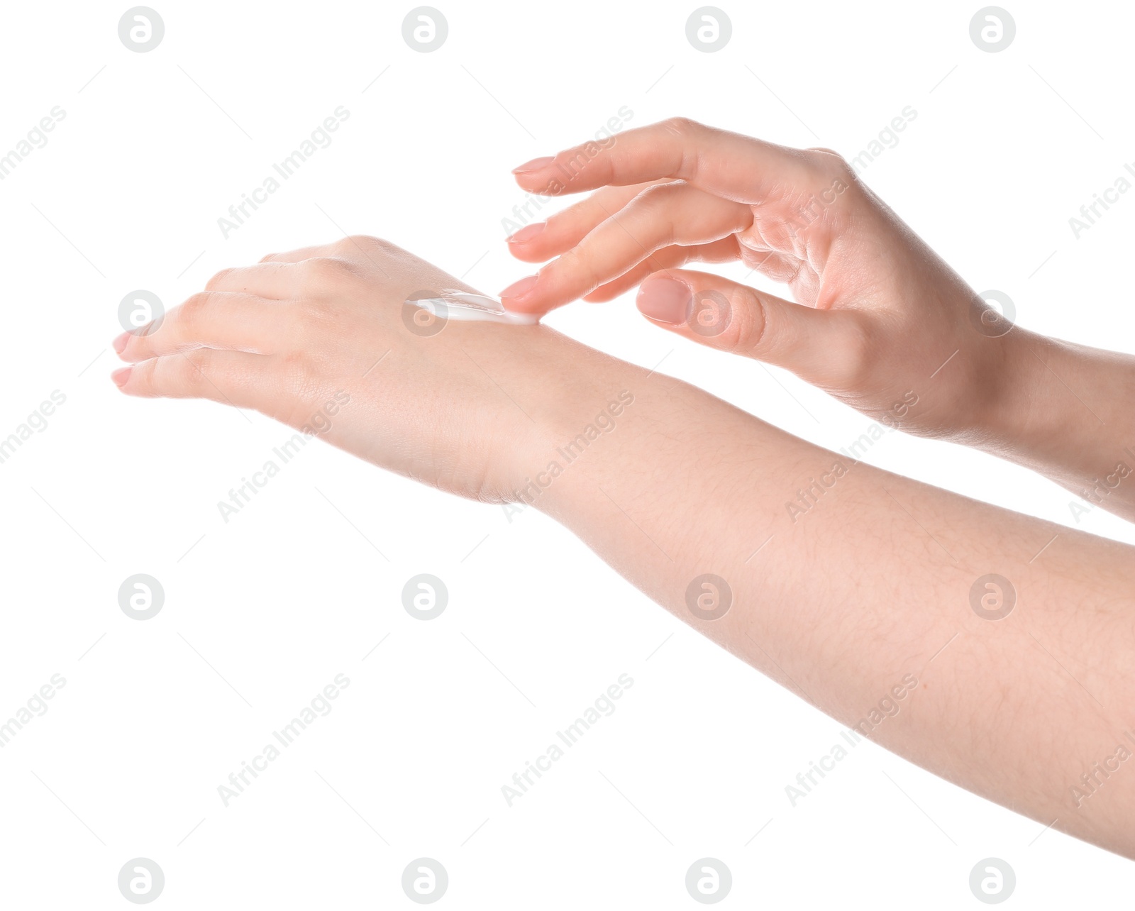 Photo of Woman applying cream on her hand against white background, closeup