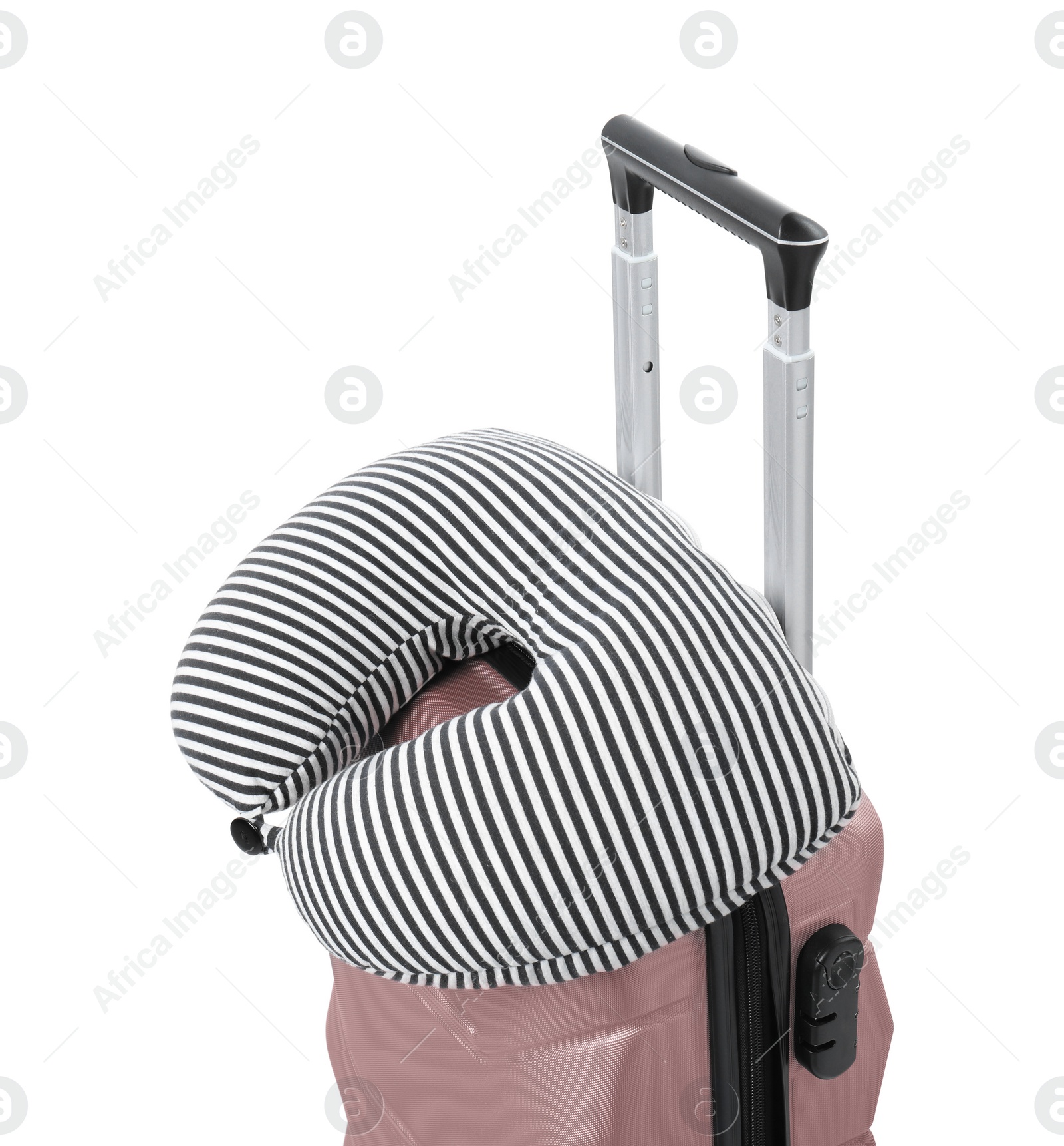 Photo of Soft travel pillow on suitcase isolated on white