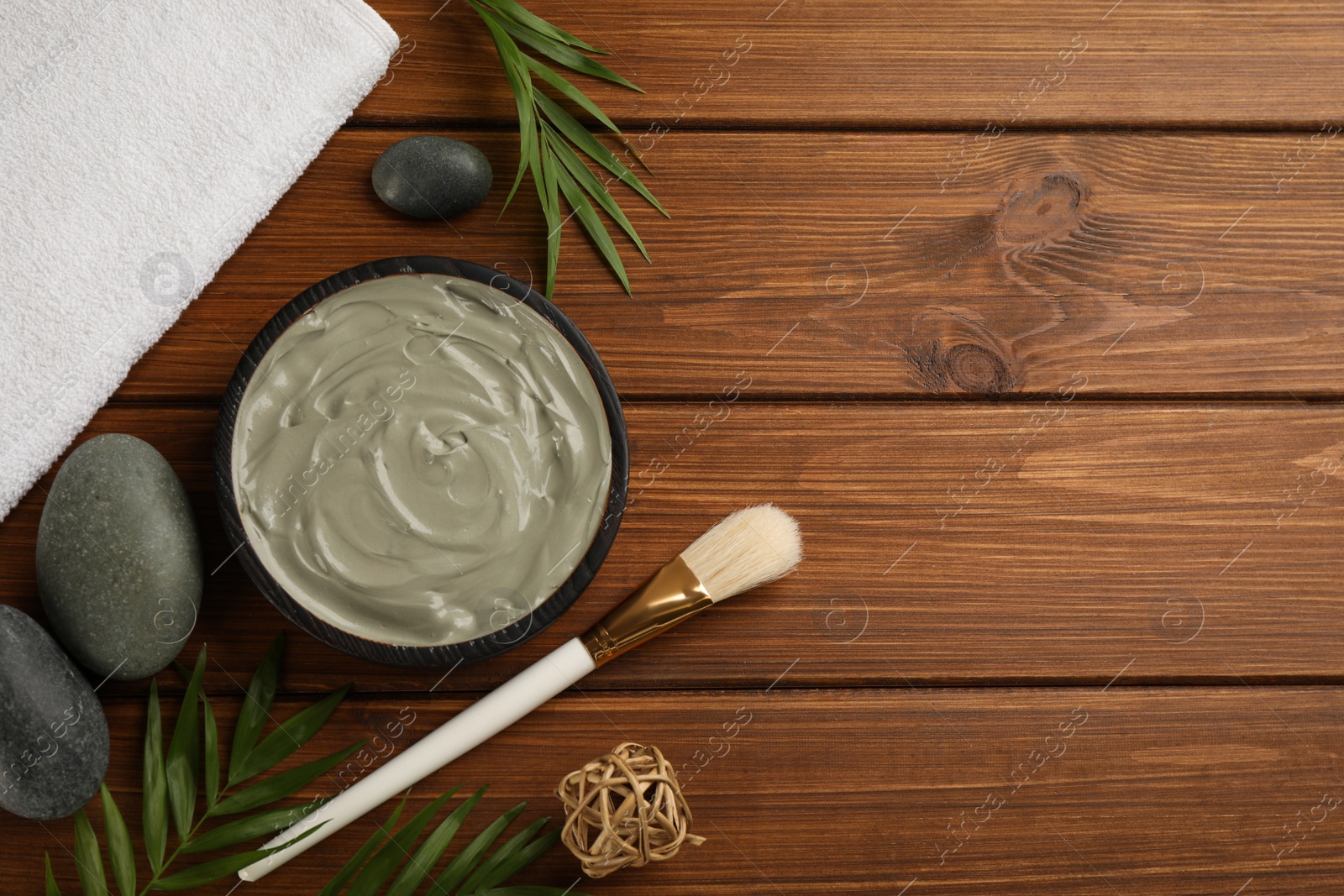 Photo of Flat lay composition with cosmetic product on wooden background, space for text. Spa body wraps