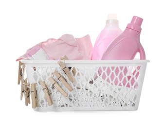 Photo of Detergents and children's clothes on white background