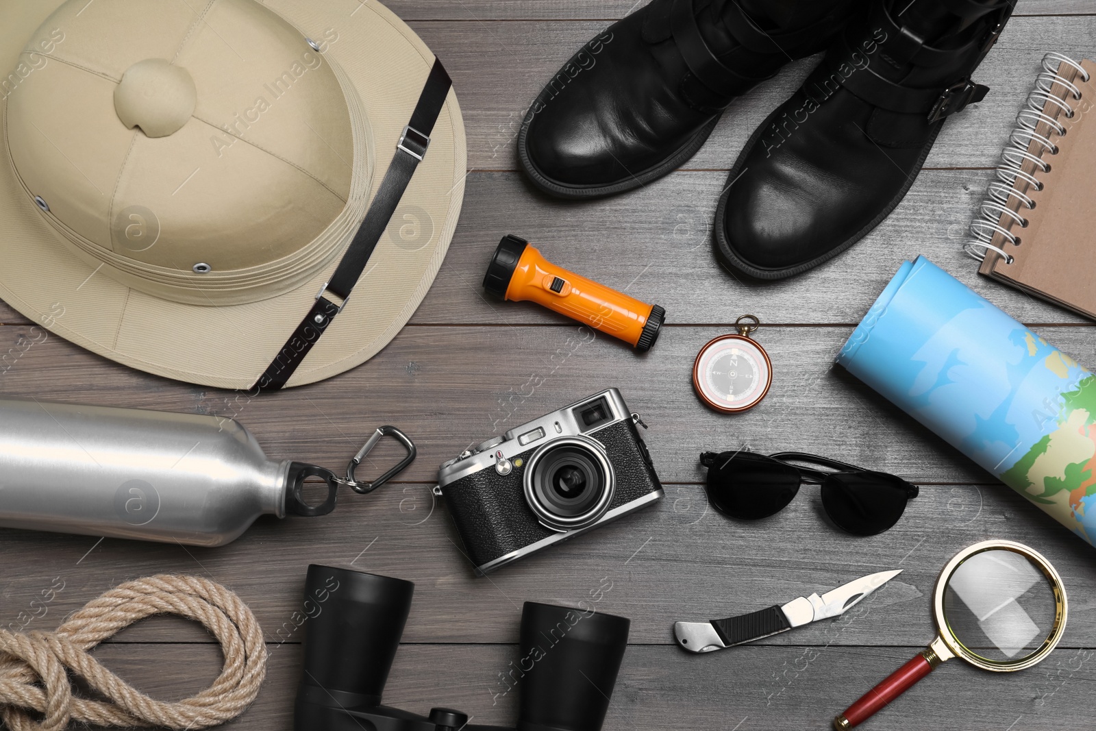 Photo of Flat lay composition with safari accessories on wooden background