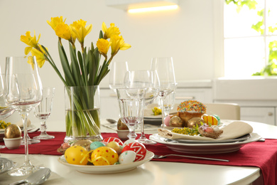 Festive Easter table setting with floral decor in kitchen