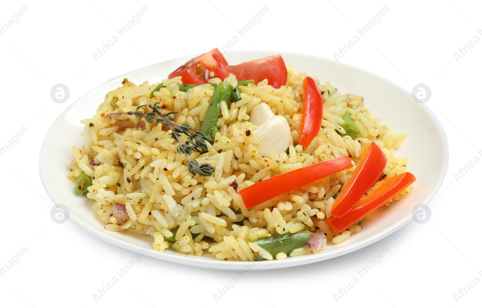 Photo of Tasty rice pilaf with vegetables isolated on white