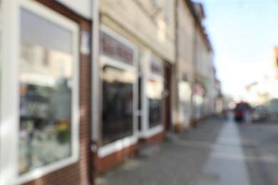 Blurred view of store exterior and city street. Bokeh effect